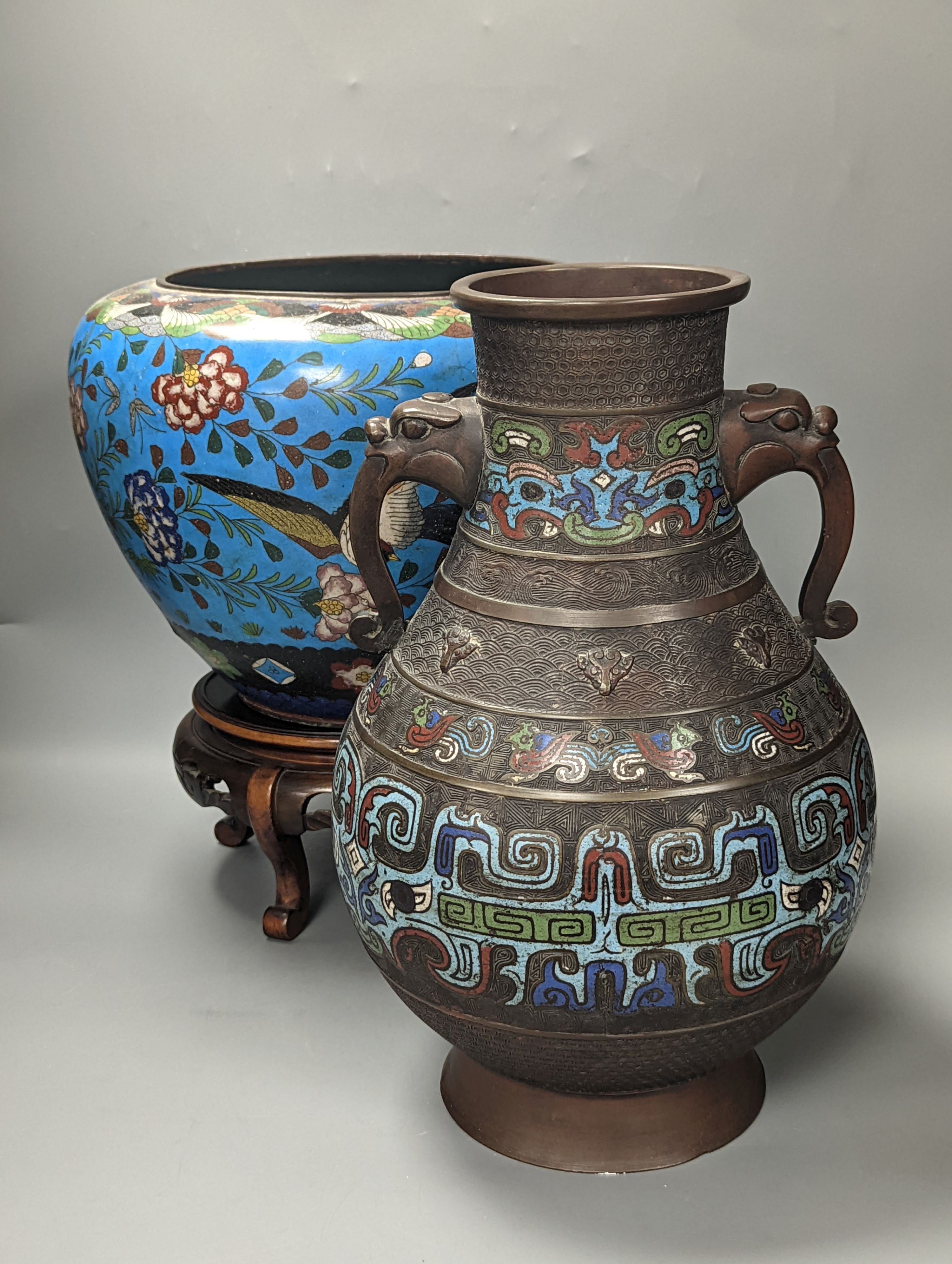 A large Japanese cloisonné enamel bowl on stand and a similar champleve enamel 2 handled vase, Cloisonné bowl and stand 36 cms high.